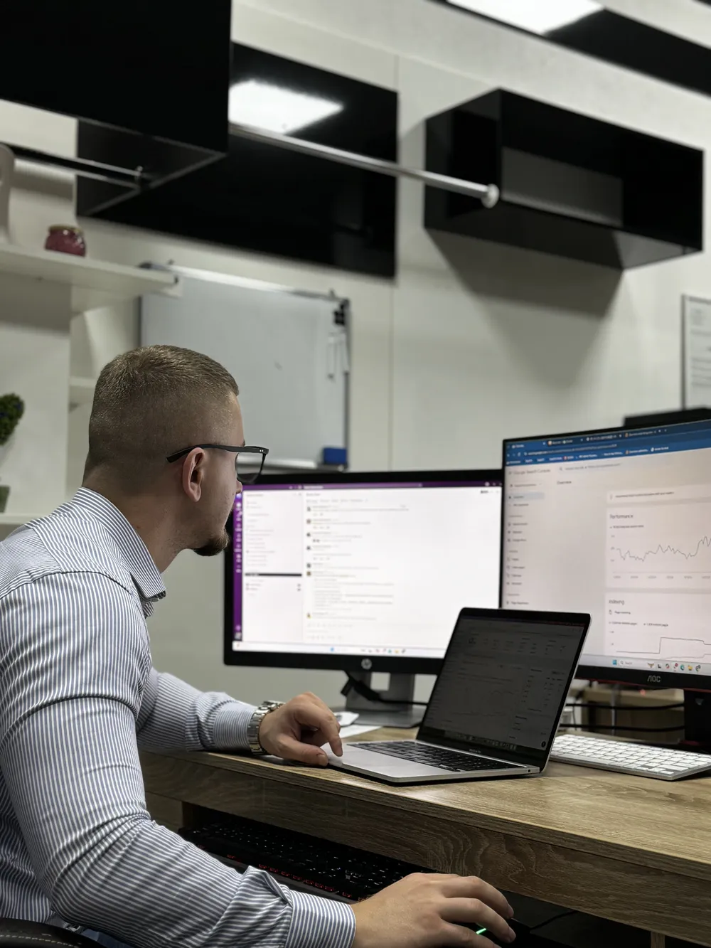 A member of the Imperia team analyzing SEO data in Google Search Console on two screens